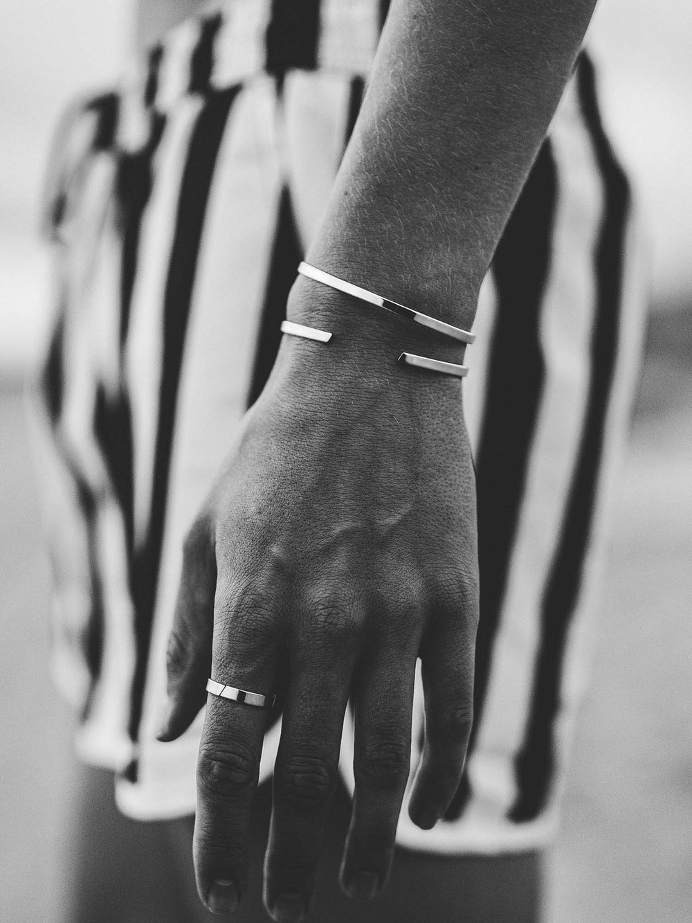 two silver minimal unisize cuffs