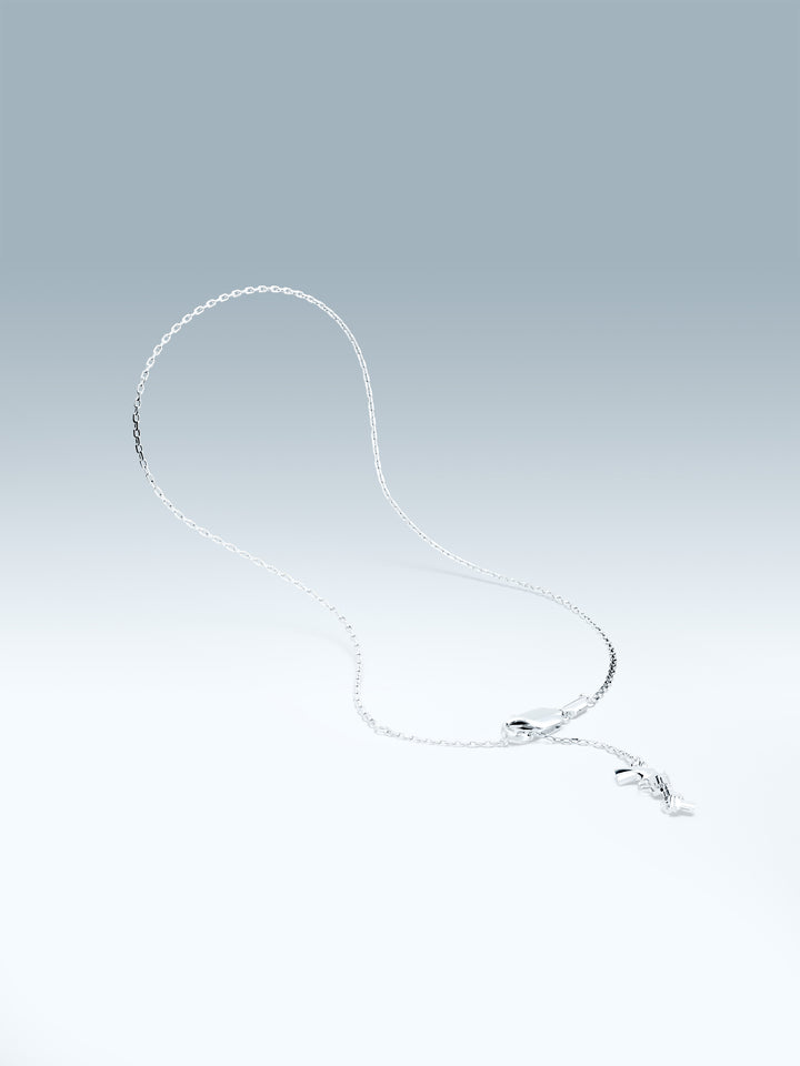 Silver bracelet with a non-violence charm on a gradient gray background