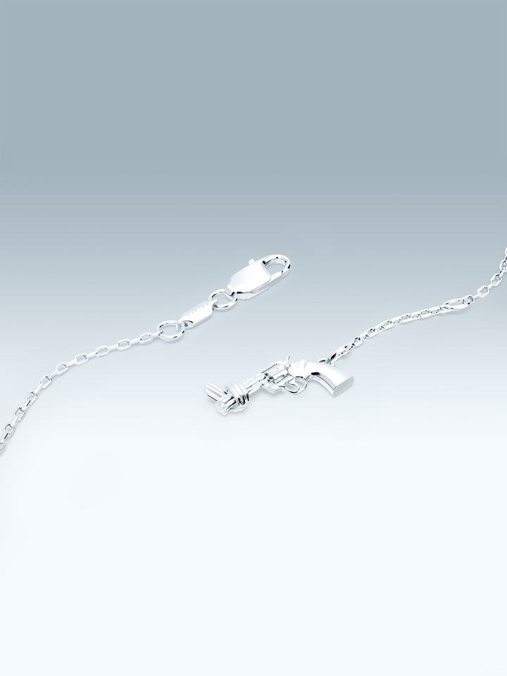Silver bracelet  with a non-violence charm on a gradient gray background