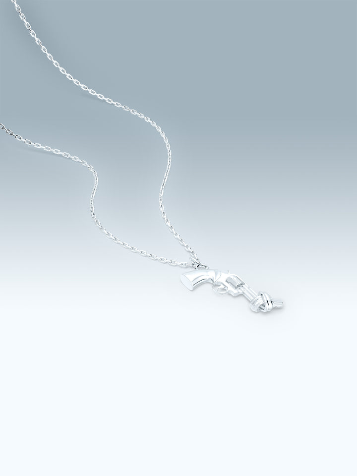 Silver necklace with a non-violence pendant on a gradient gray background