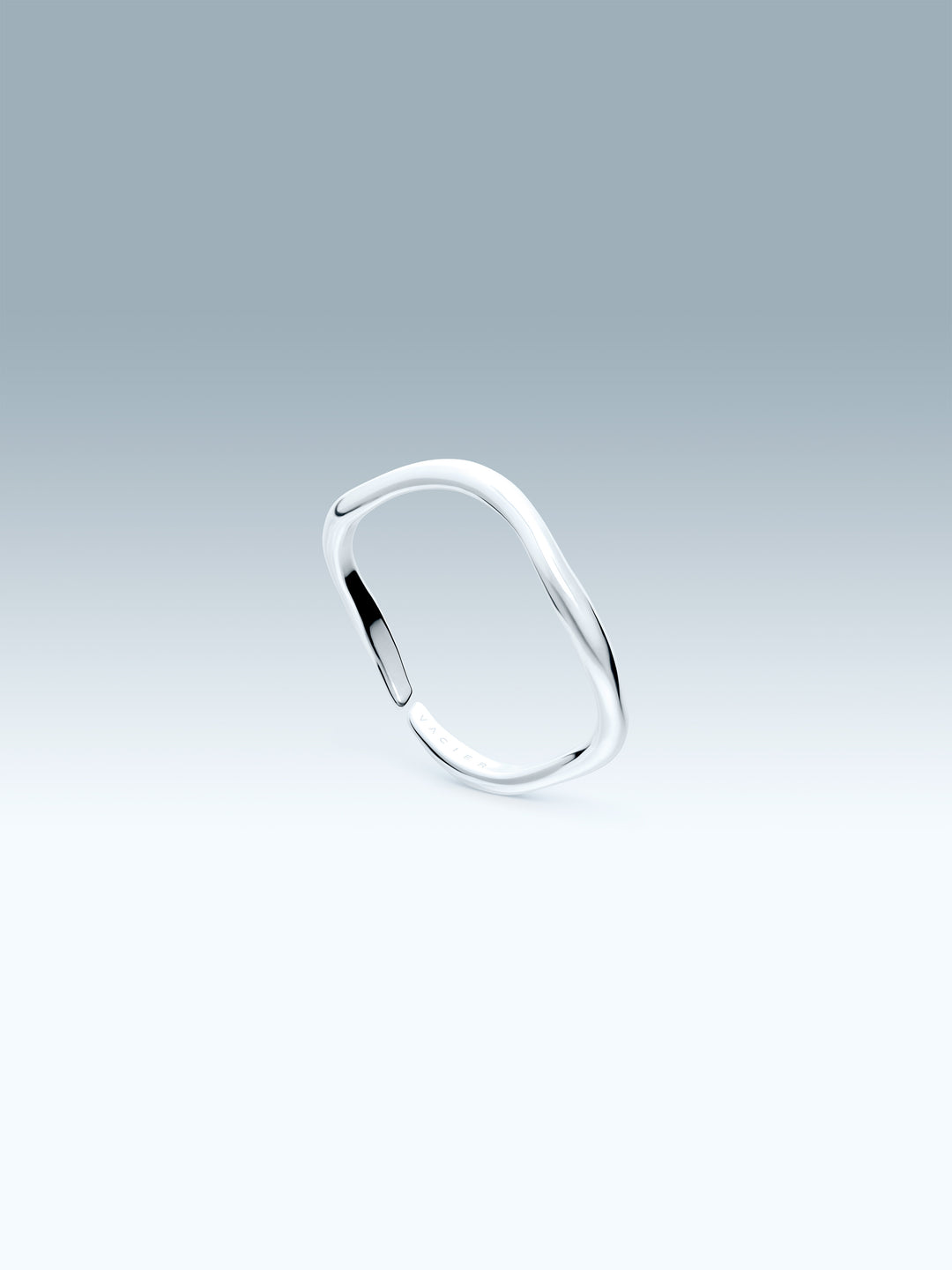 Silver ring on a gradient gray background