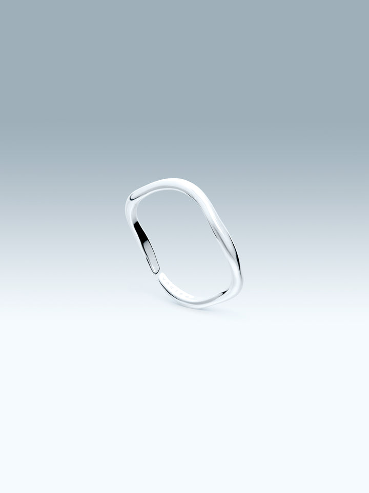 Silver ring on a gradient gray background